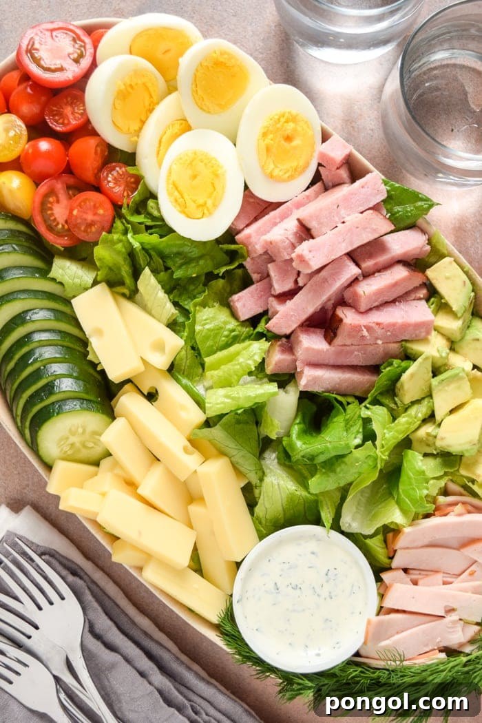 Signature Deli Salad 2 Chef Salad Platter - A visually appealing, hearty salad presented beautifully.