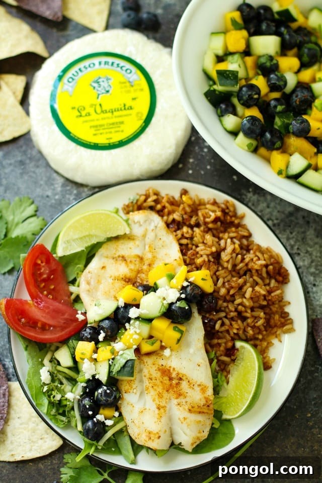 Orange roughy with blueberry mango salsa, showcasing a colorful and fruity topping for the fish.