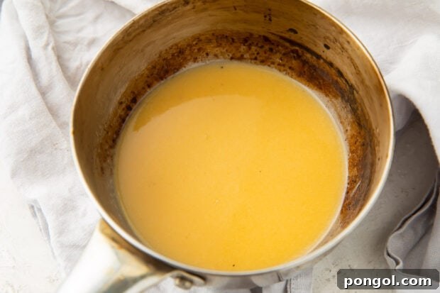 Lemon butter sauce in a silver bowl