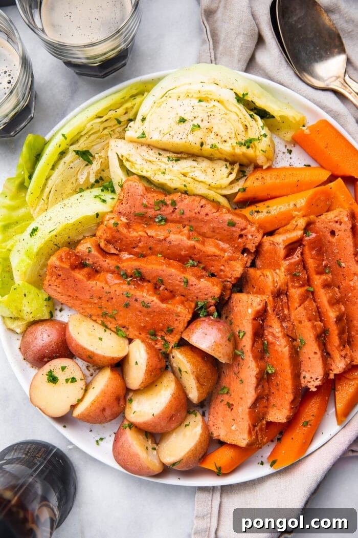 Platter of vegan corned beef and cabbage with potatoes and carrots