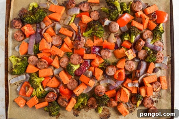 Roasted chicken sausage and vegetables served on a sheet pan