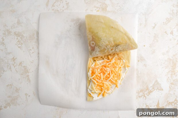 Second fold of the tortilla hack, with the first two folded quadrants now covering the tortilla chip quadrant