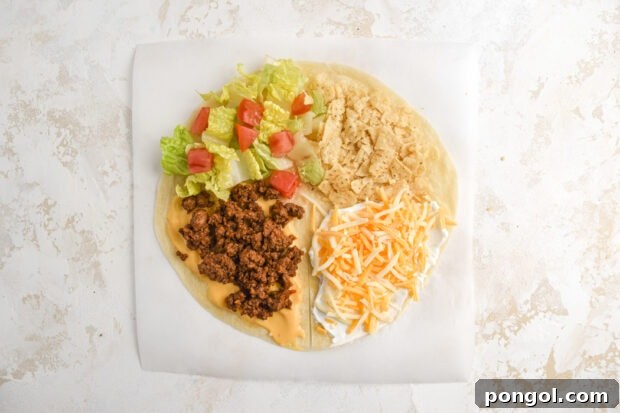 An unfolded flour tortilla with all the Mexican crunchwrap ingredients meticulously placed in each quadrant, ready for folding