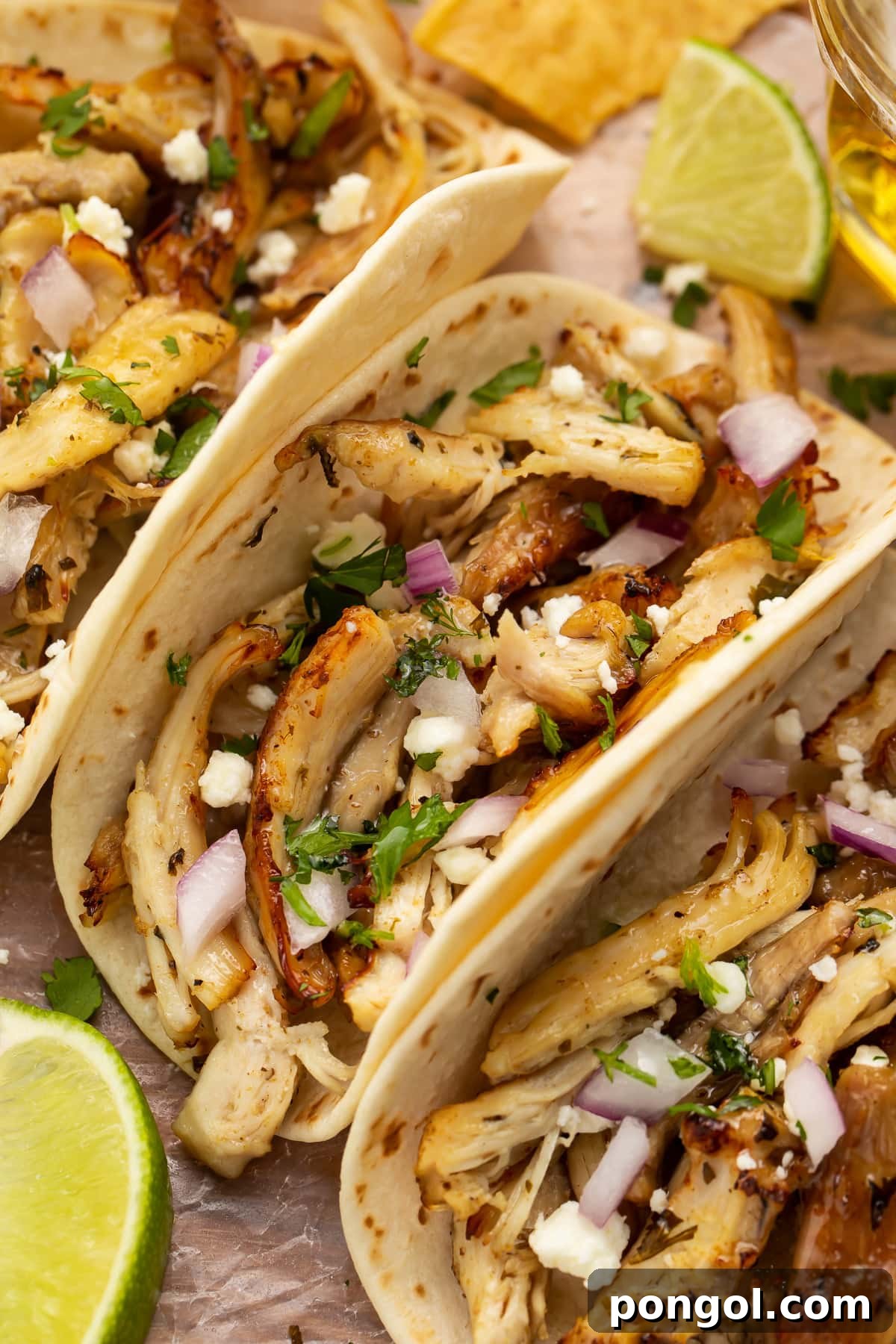 Close-up of a chicken carnitas taco with Instant Pot chicken carnitas.