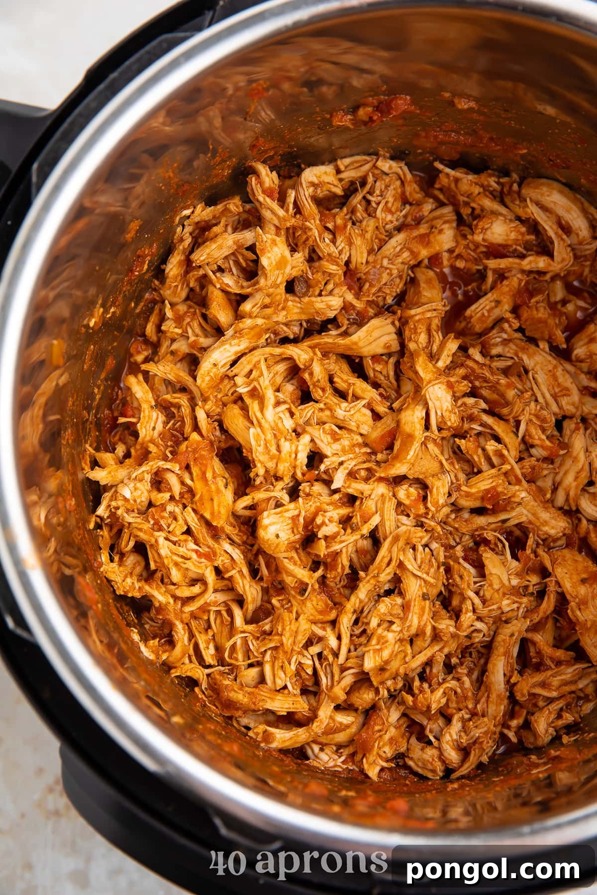 Shredded salsa chicken in an Instant Pot.