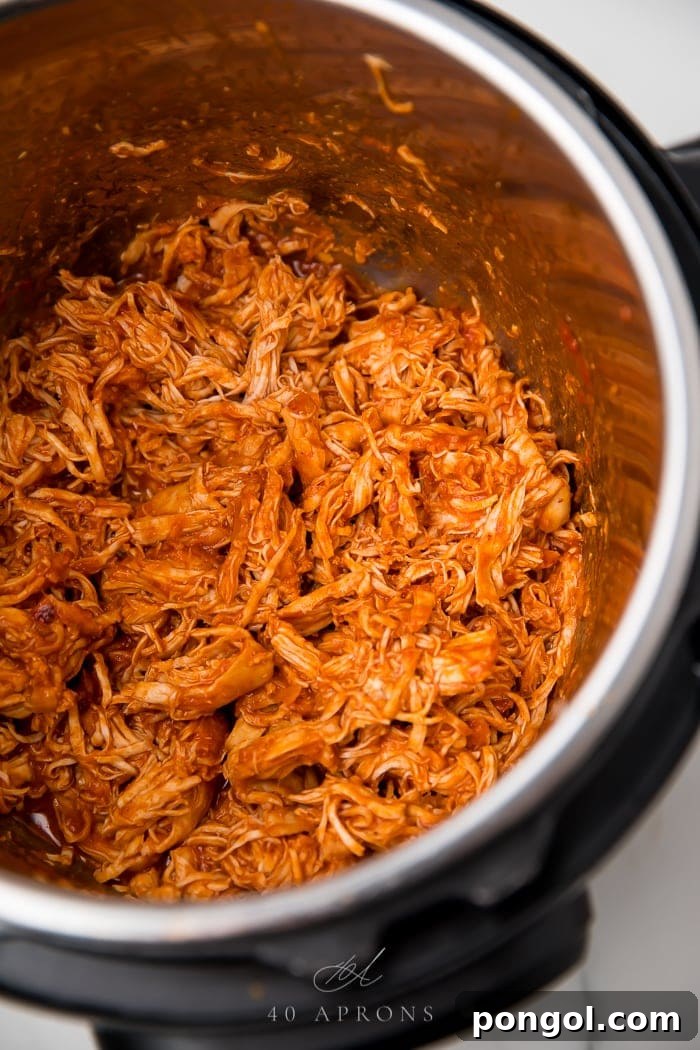 The bbq chicken shredded in an instant pot ready to serve