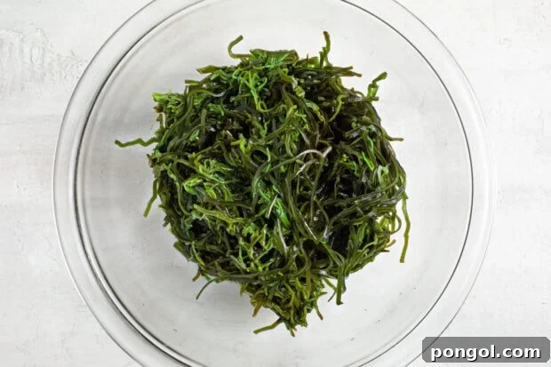 Dried seaweed soaking in cold water in a bowl.