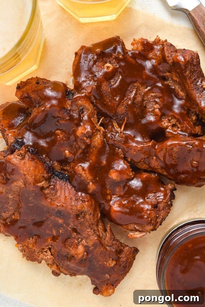 Close-up of tender Instant Pot Country Style Ribs, glistening with barbecue sauce, and ready to be enjoyed.