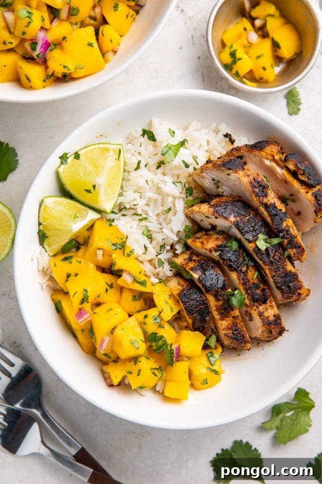 Jerk chicken bowl with coconut rice and mango