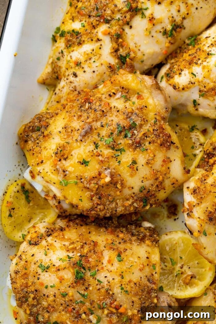 Zesty Lemon Pepper Chicken 2 Lemon pepper chicken thighs in a white baking dish