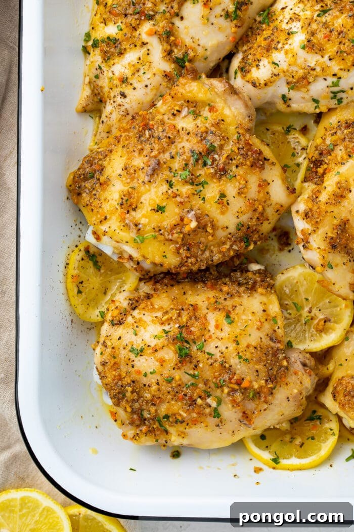 Zesty Lemon Pepper Chicken 3 Lemon pepper chicken thighs in a white baking dish