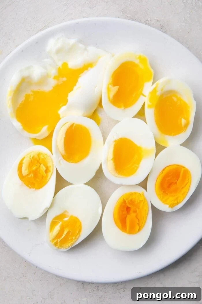 Various halved Instant Pot eggs on a white plate