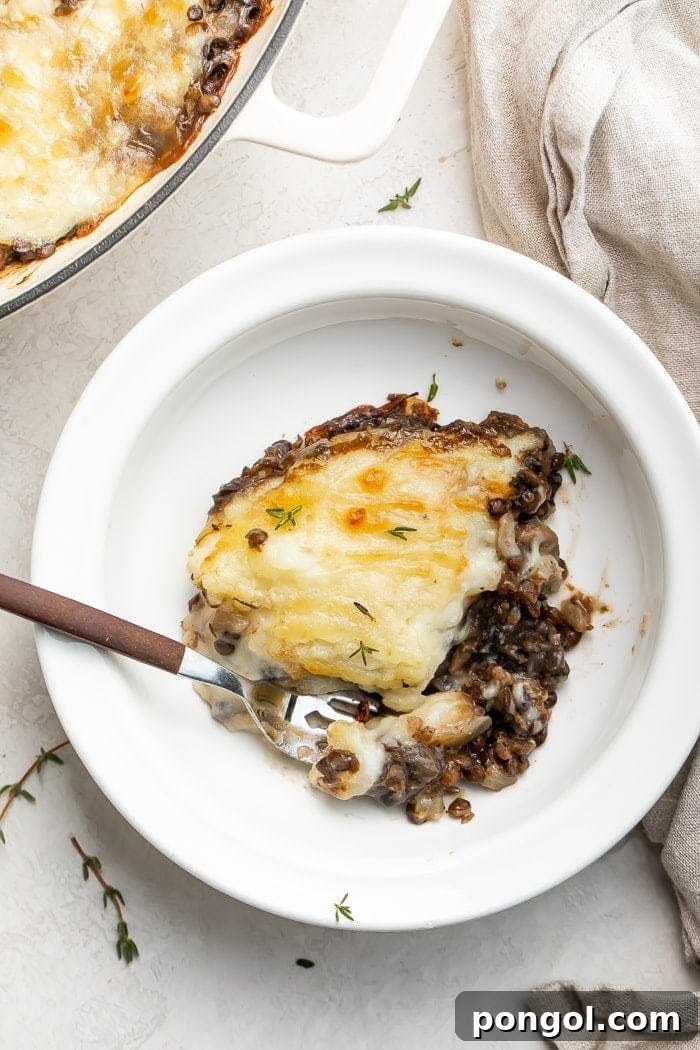 Delicious vegetarian shepherd's pie, golden brown and bubbly, in a cast-iron skillet
