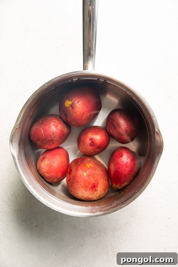 Potatoes boiling in a saucepan