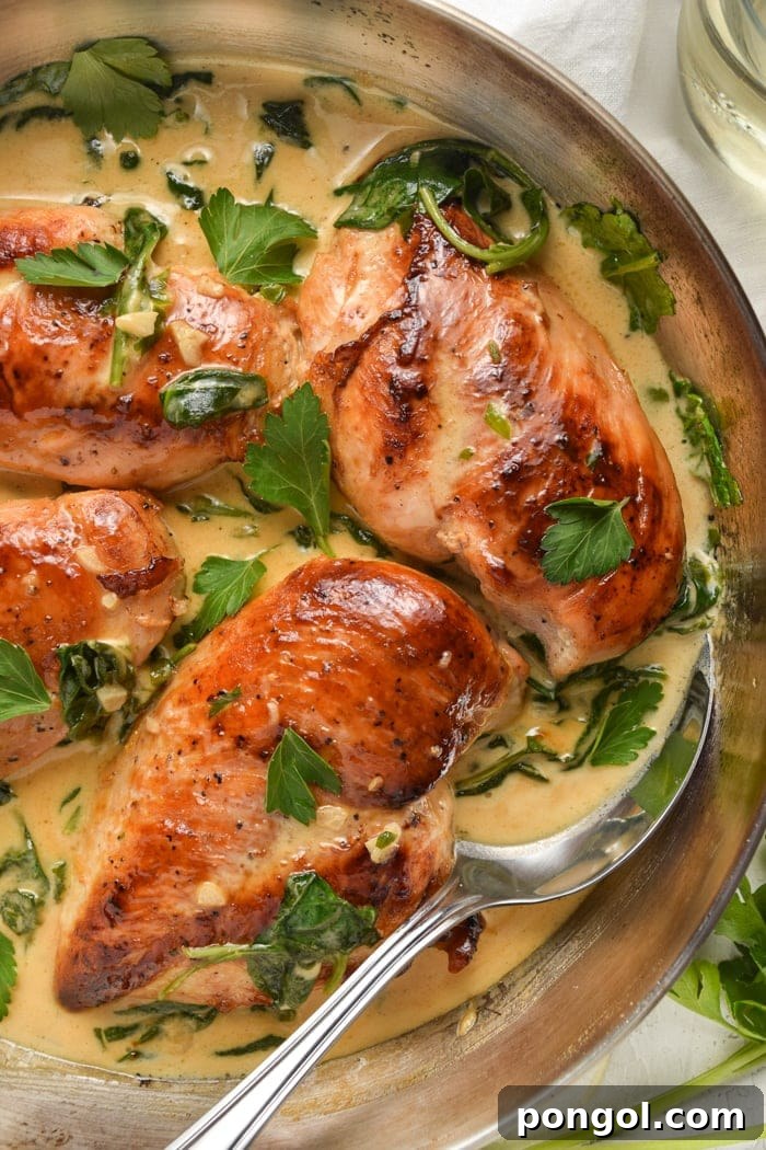 Chicken Florentine served in a skillet with creamy sauce and spinach