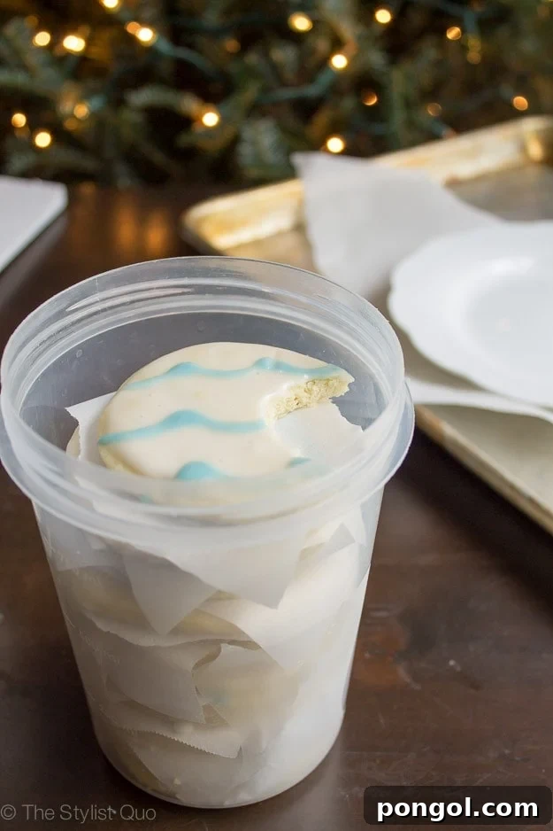 Festive Frosted Delights 7 Christmas Sugar Cookies stacked in a container