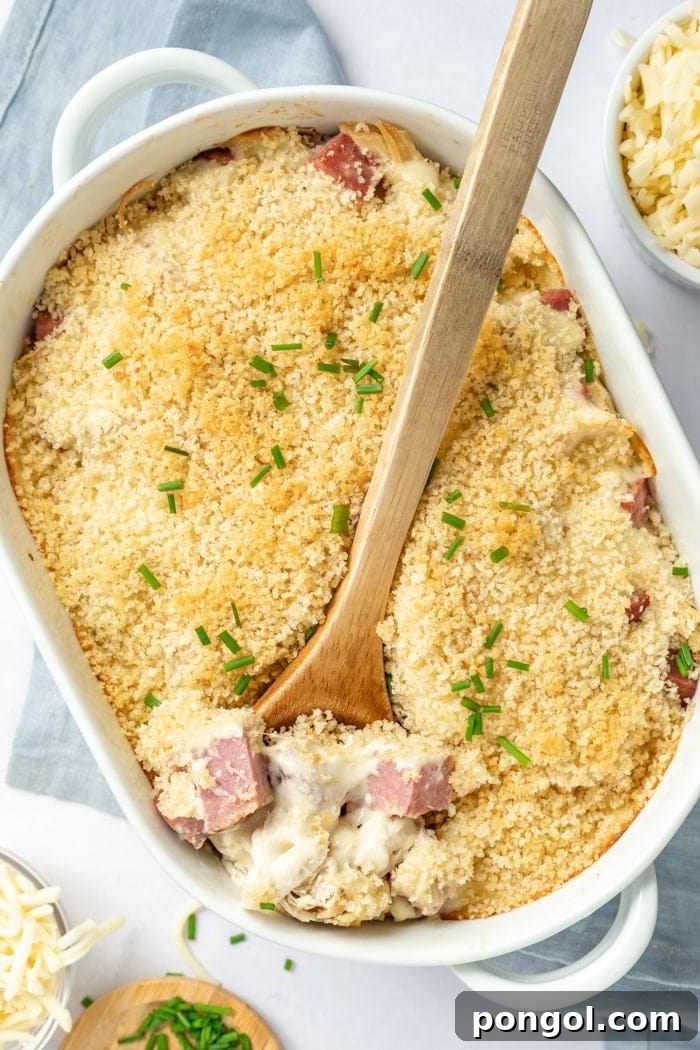 Closeup of Chicken Cordon Bleu Casserole with golden topping and creamy interior