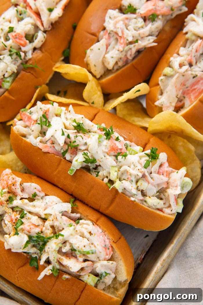 Crab salad in buns on a sheet pan, ready to be served as an easy and delicious meal or appetizer.