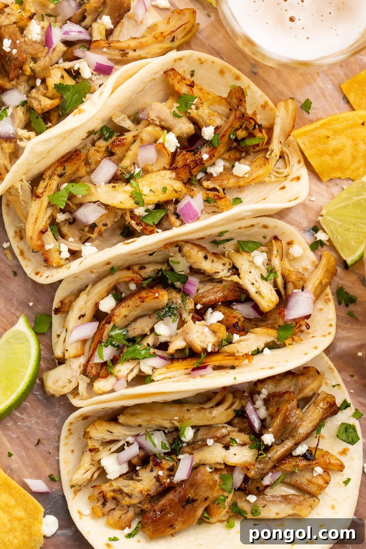 Mexican Chicken Extravaganza 21 Zoomed out photo of a chicken carnitas taco with Instant Pot chicken carnitas.