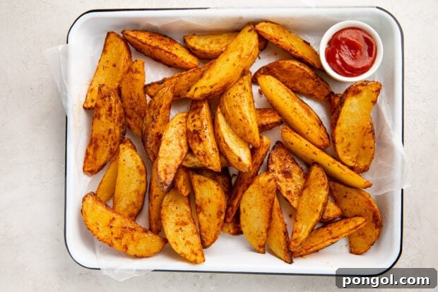 Air fryer potato wedges served on a plate
