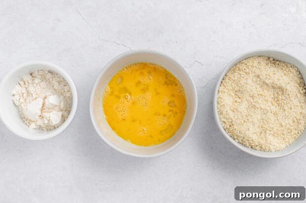 Air Fryer Zucchini Chips ingredients prepared for dredging.