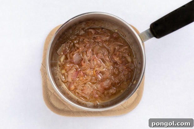 Dressing ingredients simmering in a saucepan.