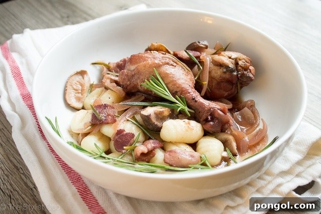 Red Wine-Braised Chicken with Rosemary and Mushrooms served over gnocchi