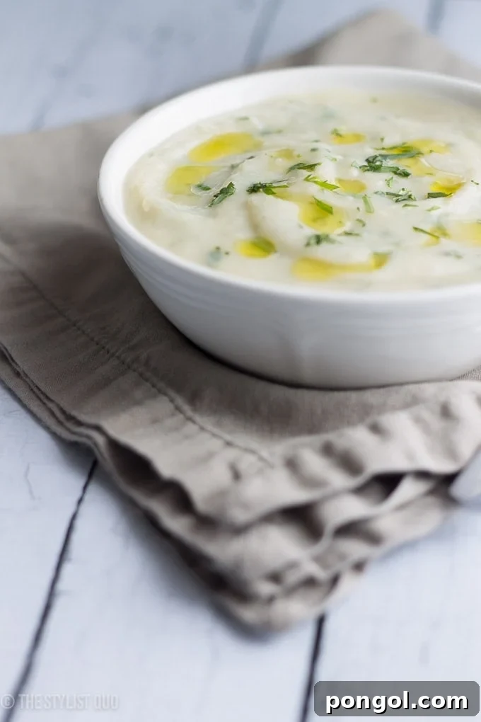 Overhead view of Mashed Potato Soup with fresh tarragon