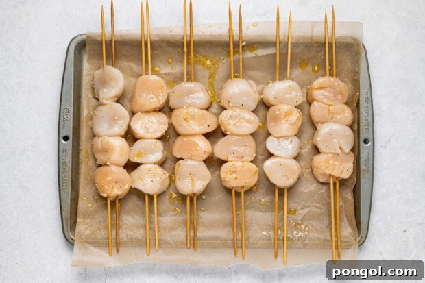 Grilled-Scallops-Process-Photo-02: Scallops being threaded onto skewers.