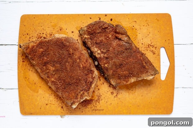 Removing sous vide ribs from the bag and patting dry.