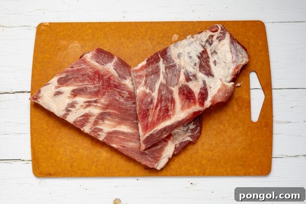 Removing membrane and slicing ribs for sous vide.