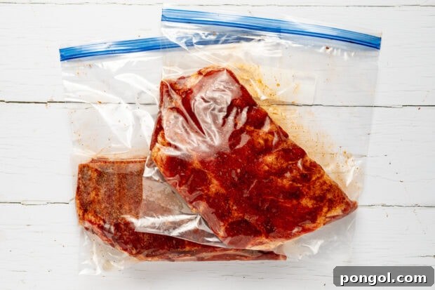 Sealing ribs in a bag and placing them into the sous vide bath.
