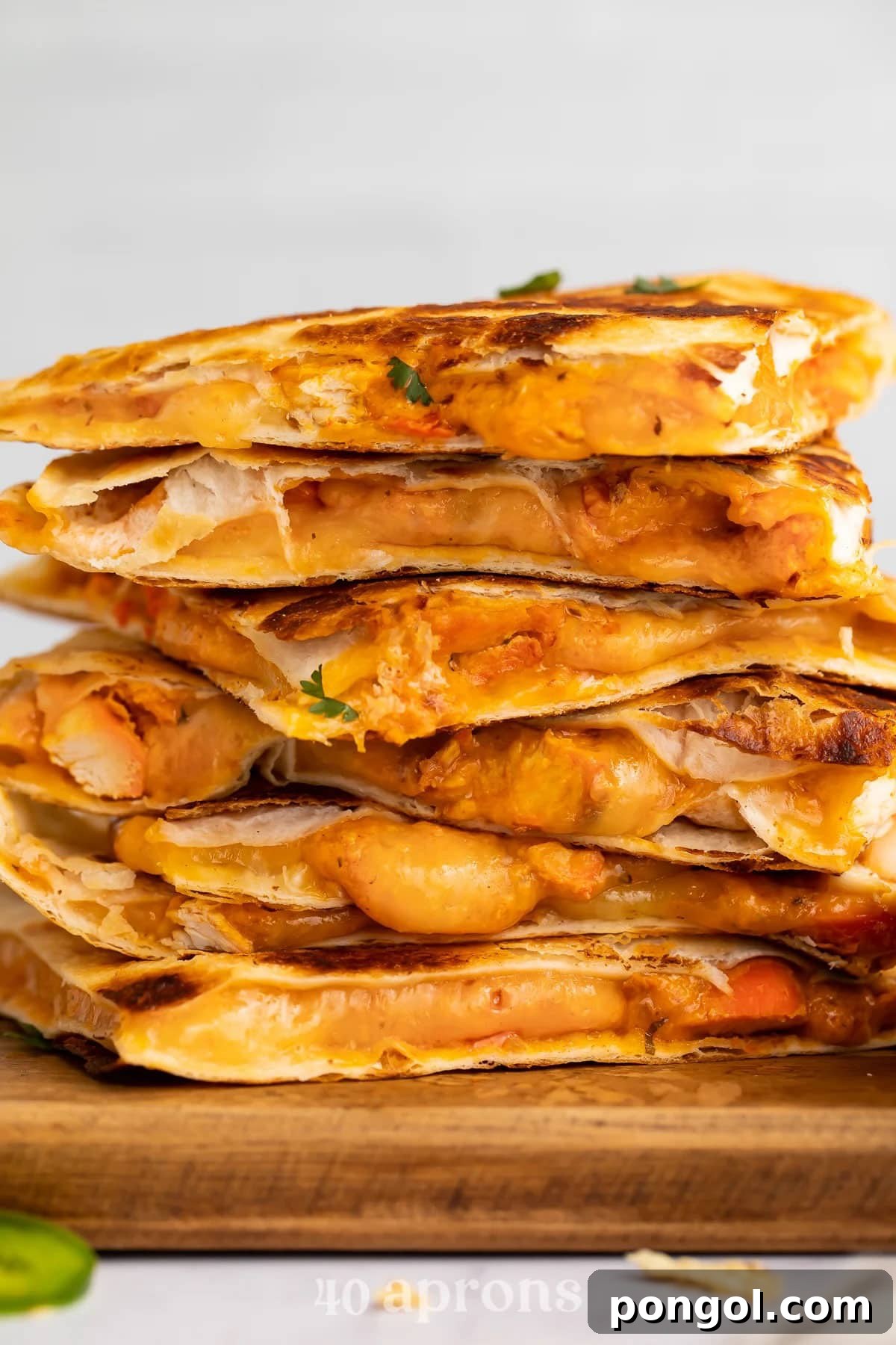125 Simple Chicken Dinners: Fast Meals with Pantry Staples 51 6 Chicken tikka masala quesadilla wedges stacked on top of eacher.