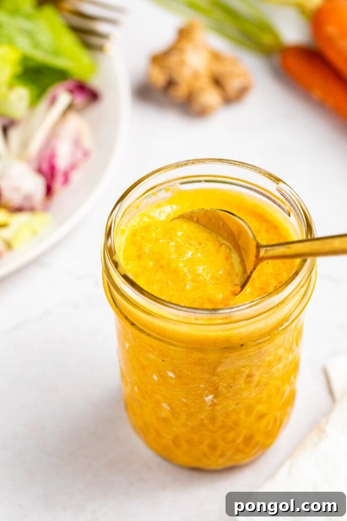 Classic Japanese Salad Dressing 2 Japanese salad dressing in a jar with a spoon.