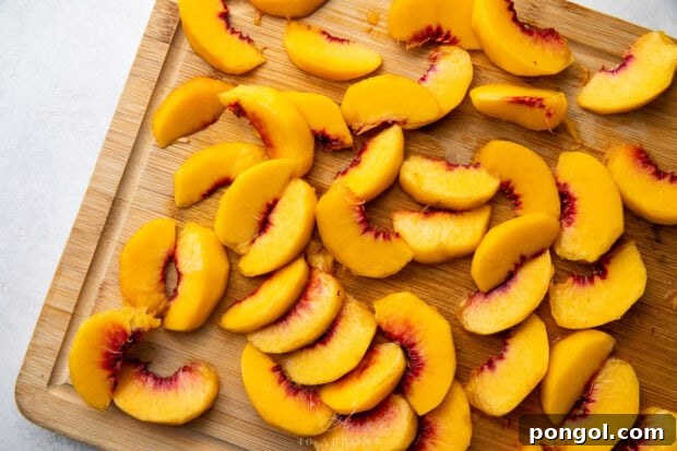 Peach slices on a cutting board