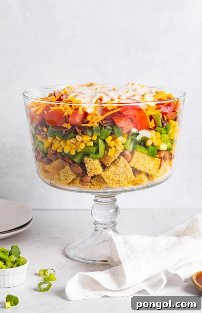 cornbread salad layered in a trifle dish