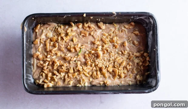 Unbaked vegan zucchini bread in loaf pan