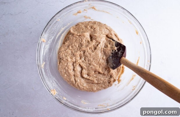 Vegan zucchini bread batter in large glass mixing bowl