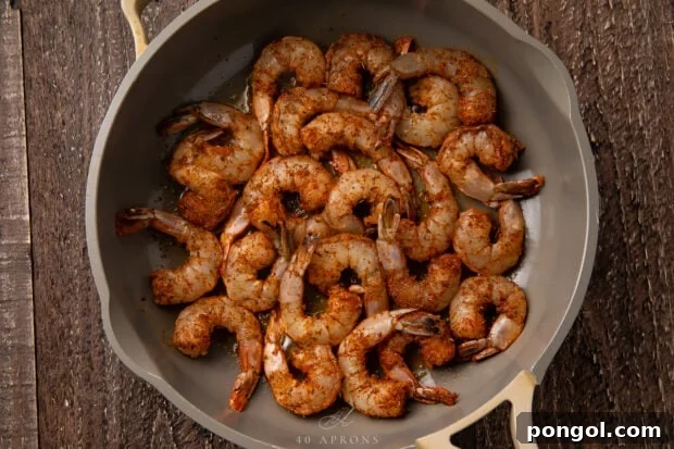 Easy Weeknight Blackened Shrimp 6 Blackened shrimp in skillet.