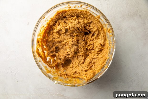 Gluten free peanut butter cookie dough in large glass mixing bowl