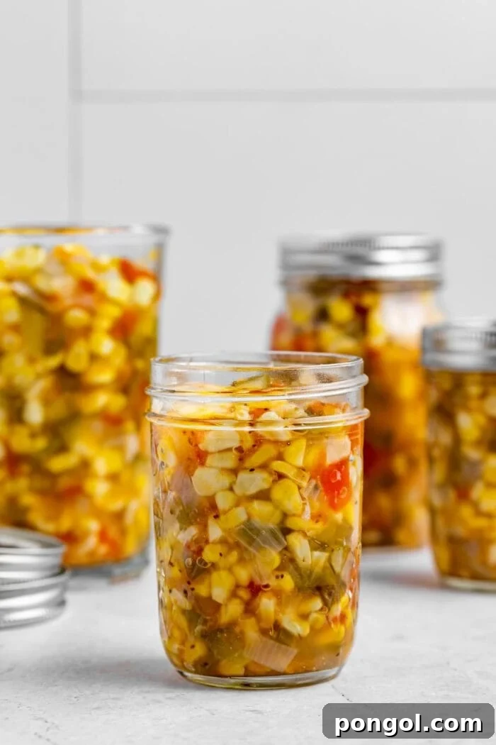 corn relish in four canning jars