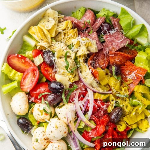 Antipasto salad in a large white bowl, taken from above.