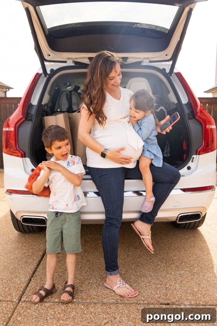 Smiling woman in a car, ready for a family road trip