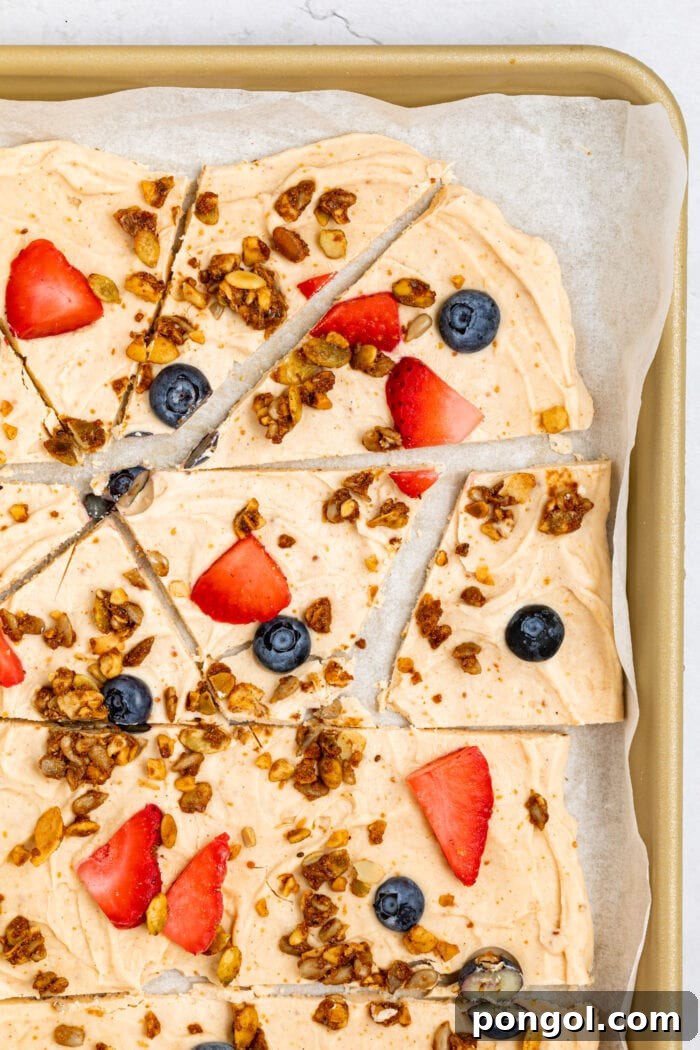 frozen yogurt bark on a baking sheet