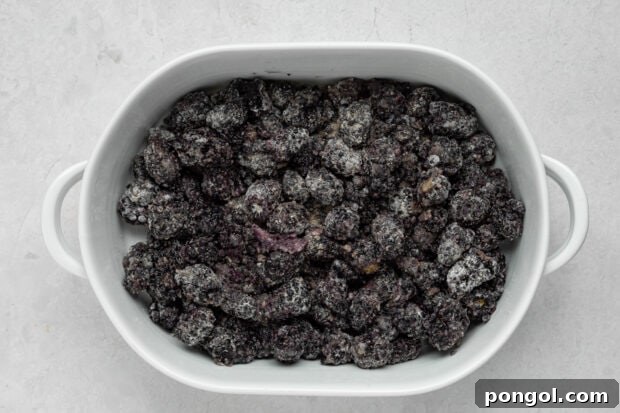 Blackberry filling being mixed in a bowl