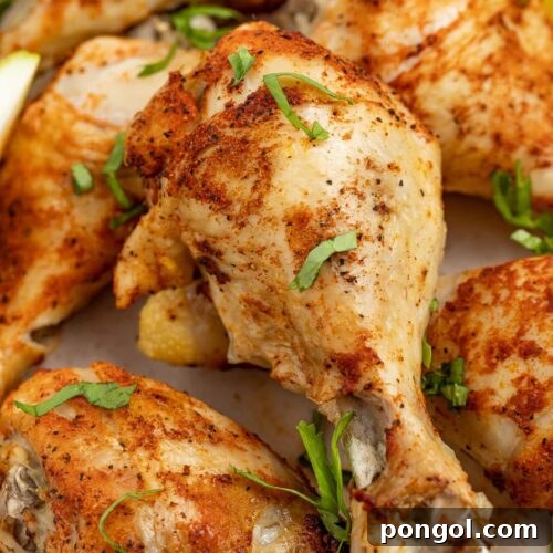 close up image of instant pot chicken legs with fresh parsley on top