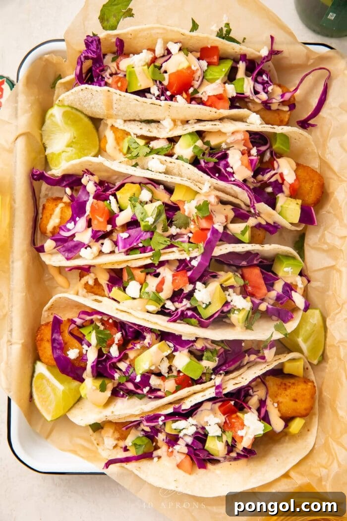 Quick Fish Stick Tacos Ready in Just 15 Minutes 2 Overhead view of 6 fish stick tacos on a baking sheet