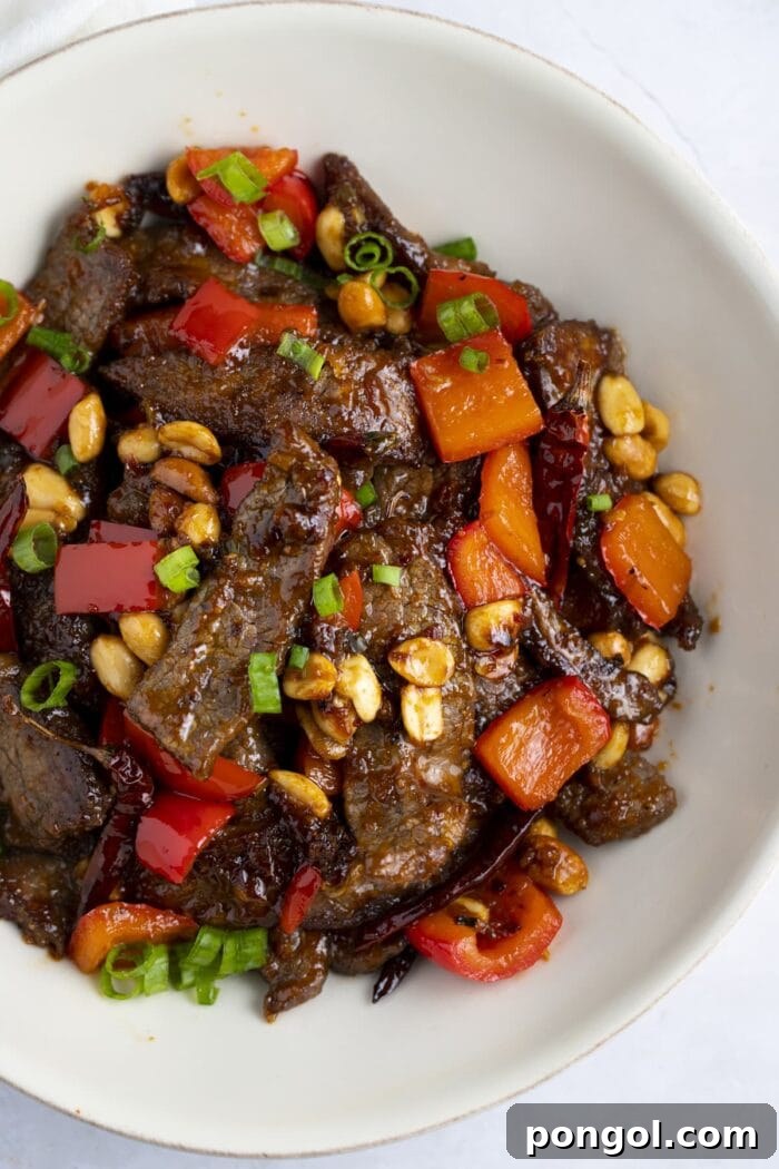 Kung pao beef in a white bowl