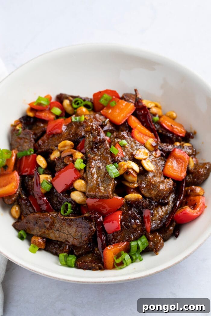 Kung pao beef in a white bowl