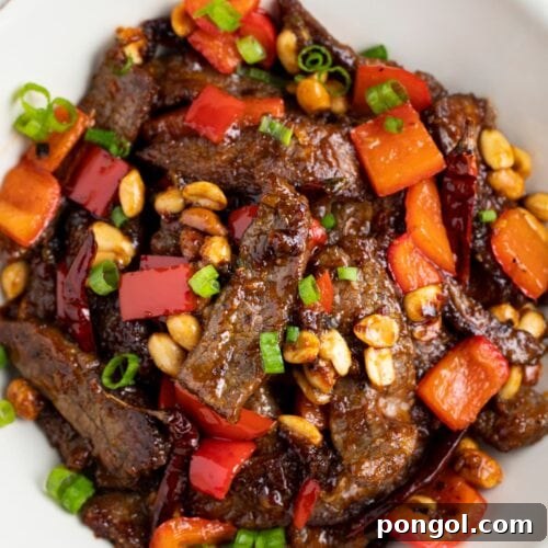 Kung pao beef in a white bowl